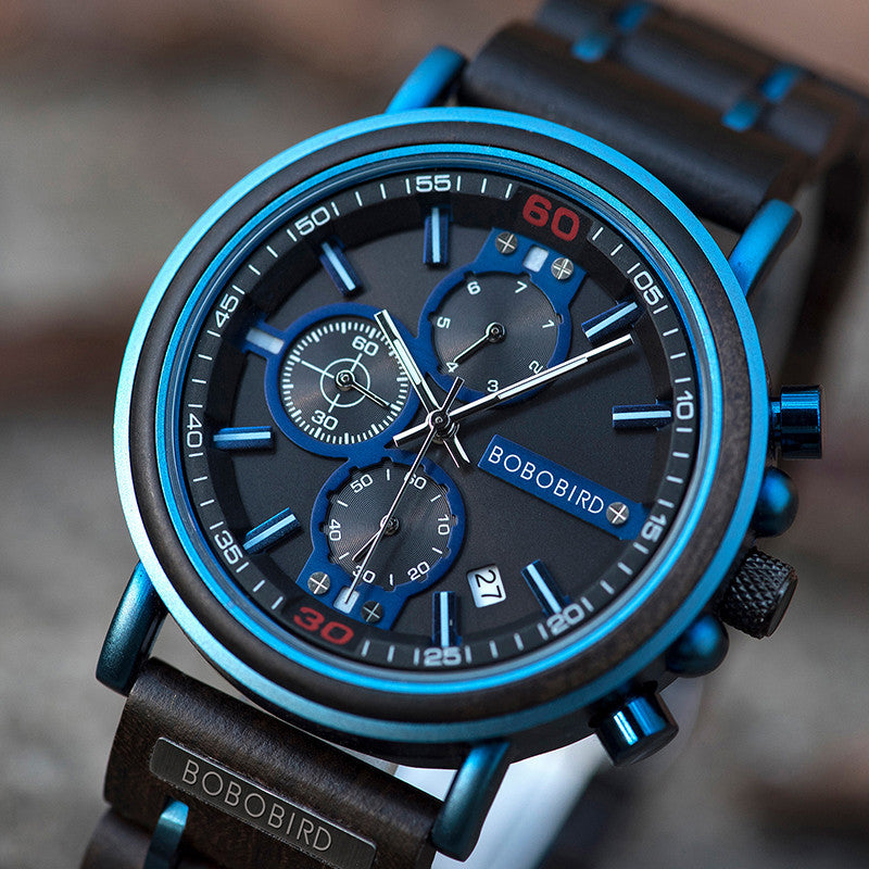 Blue dial chronograph watch mineral glass quartz movement close-up.

