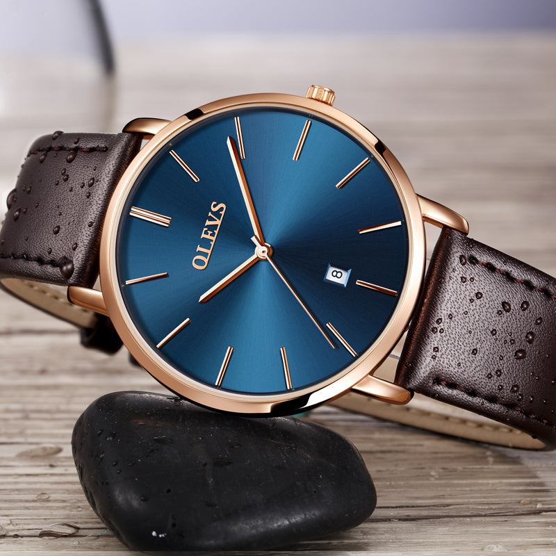 OLEVS men's slim luxury watch blue dial rose gold case leather strap Japan quartz waterproof gift.
