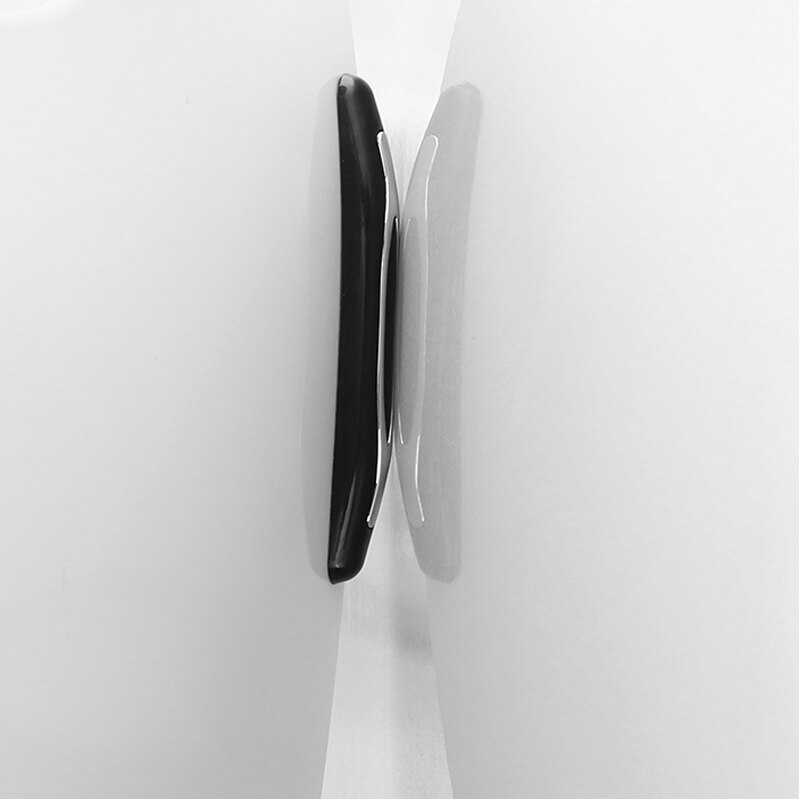 9	Hand holding white car door edge protection rubber strips – set of 4 anti-scratch moulding guards.
