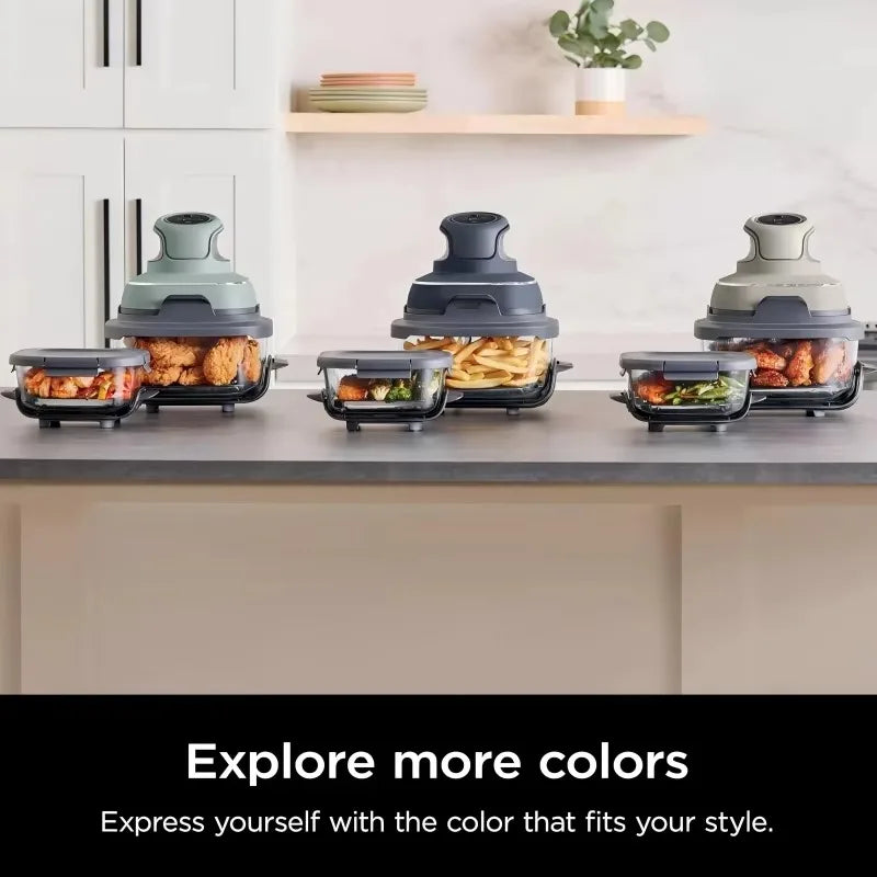 Modern kitchen countertop air fryer in black with compact square design and cool-touch housing.
