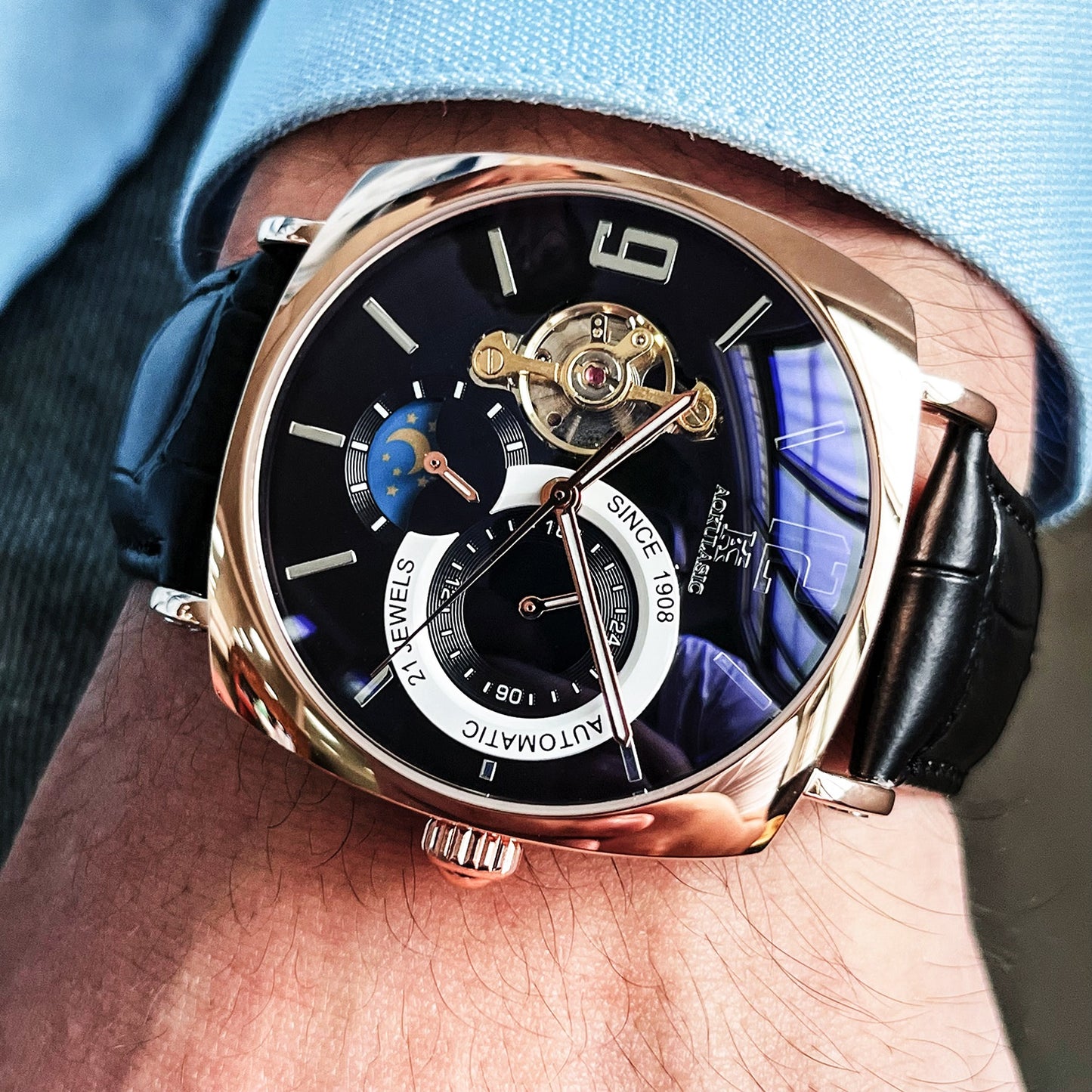 Square mechanical watch open heart tourbillon 21 jewels gold movement close-up.
