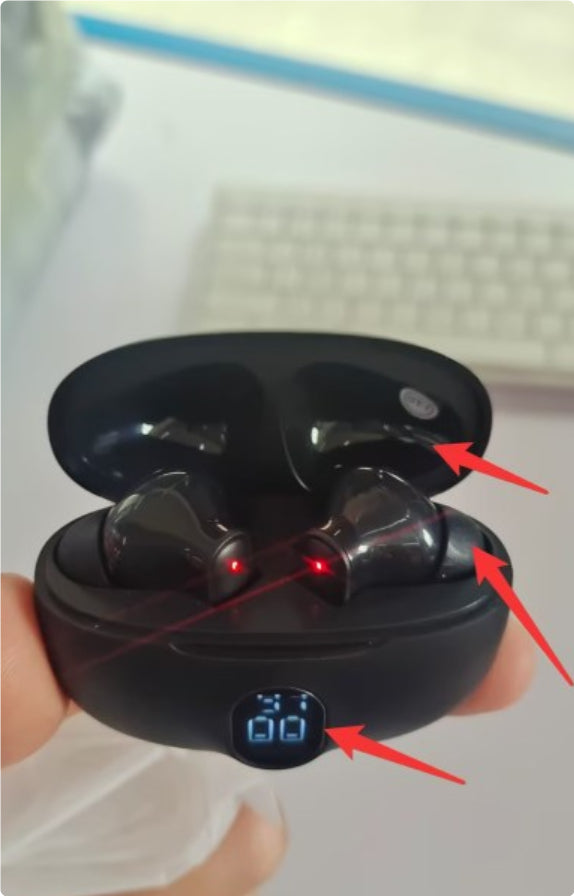 Black wireless earbuds charging case open view LED battery indicator.