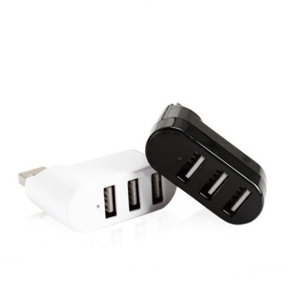 Mini USB hub splitter with coin size reference - portable laptop accessory.
